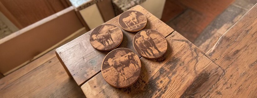Grain & Slate Co. — custom engraved coasters on rustic wood